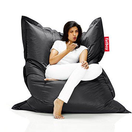 A woman sitting on Fatboy Original Bean Bag Chair - DIGS