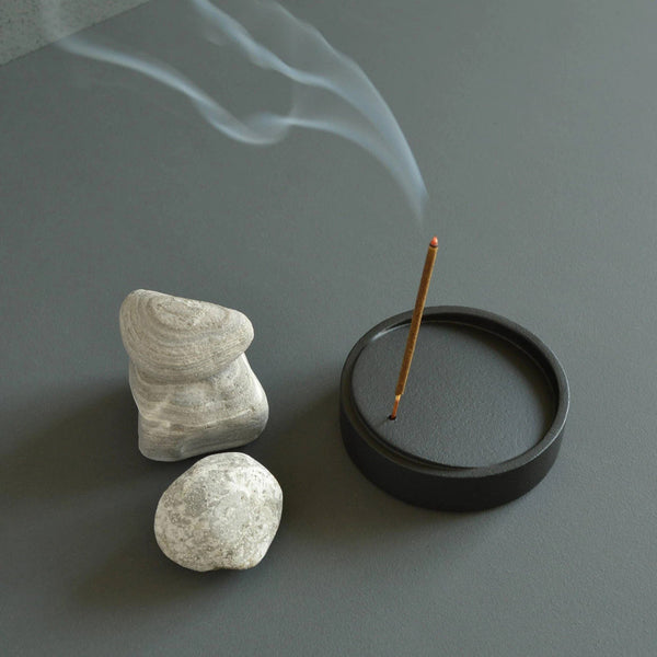 Incense besides rock