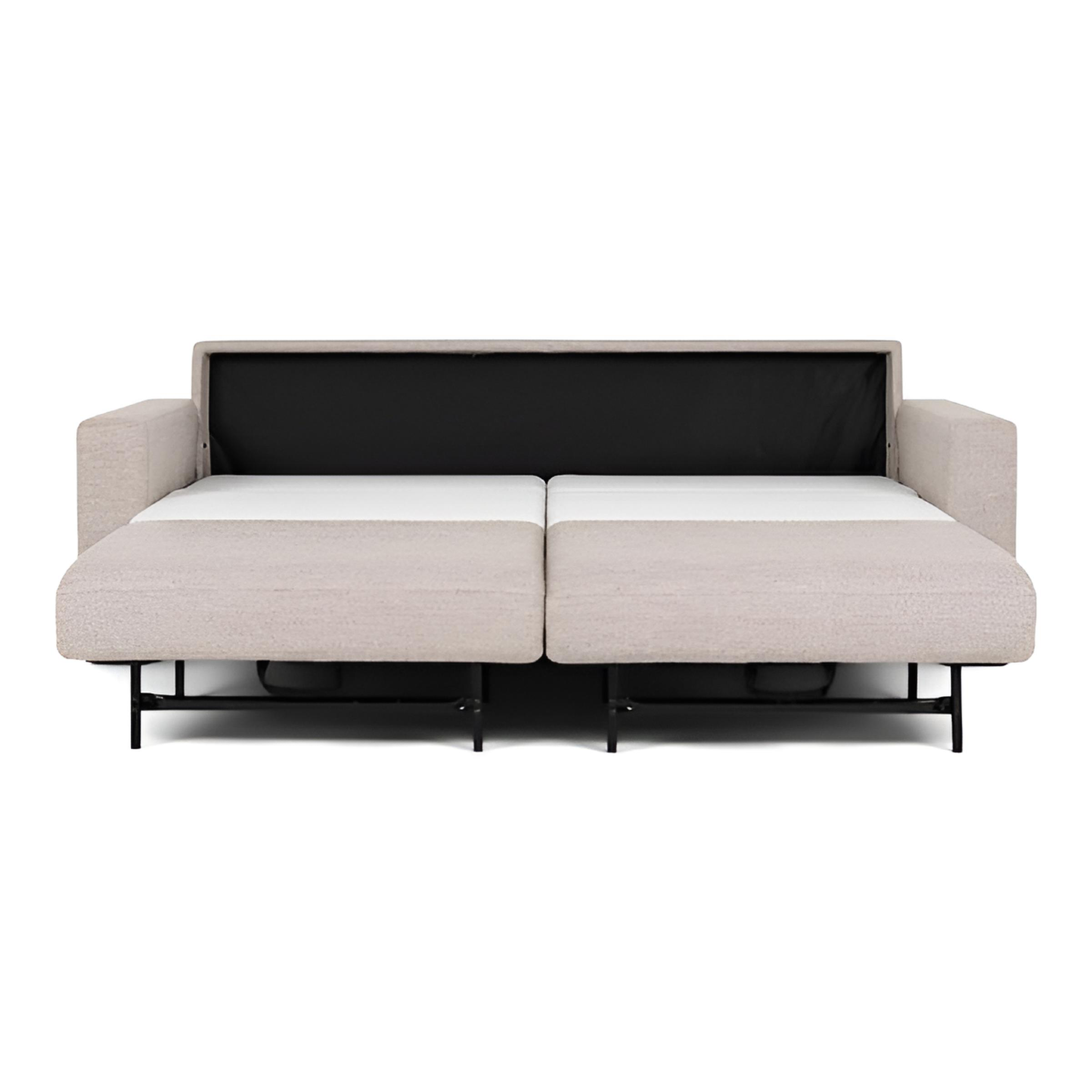 Open grey sleeper sofa on white background.