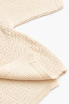 Cream Cardigan Detail on White Background