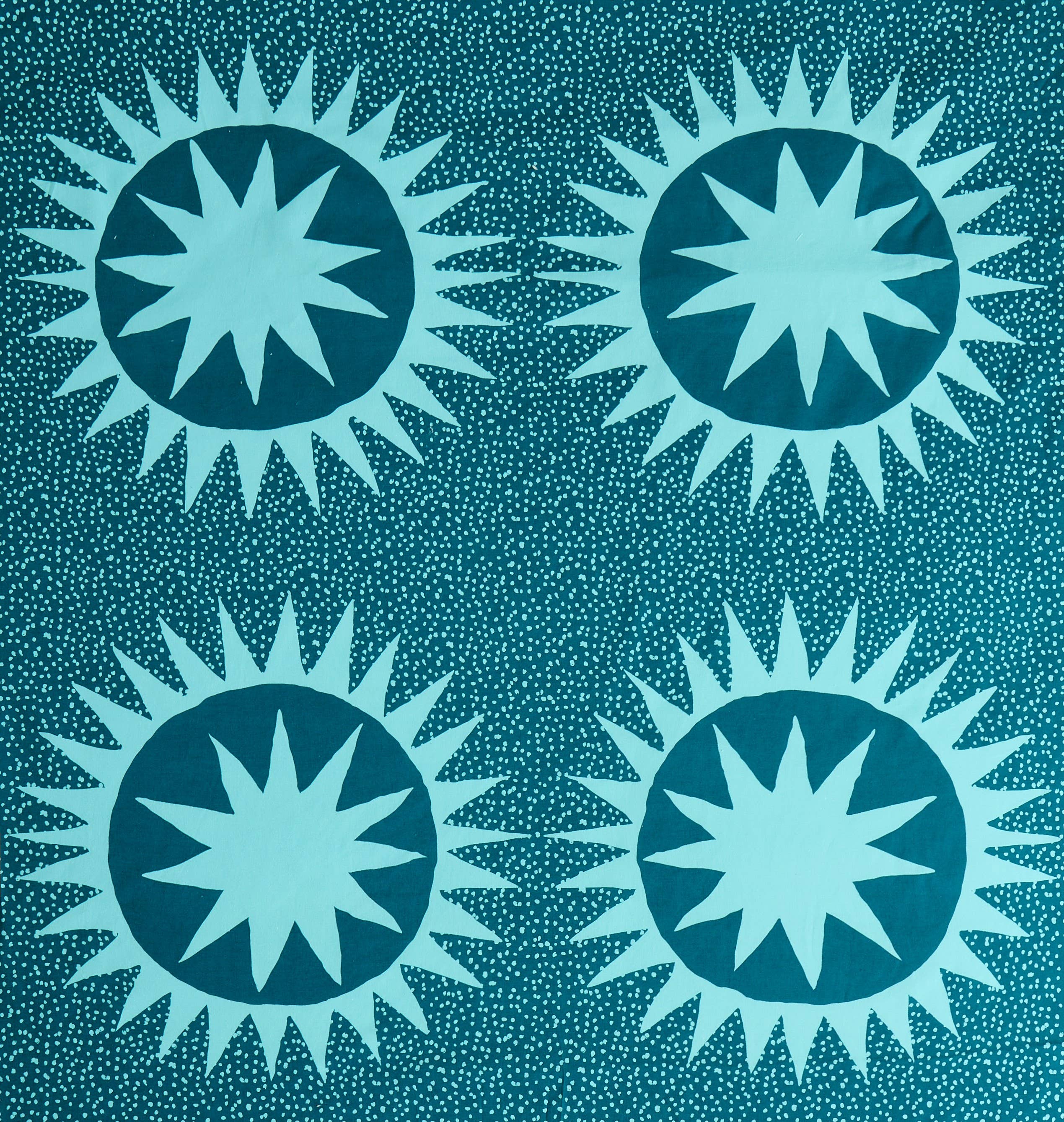 Pattern of blue starburst shapes on a teal background