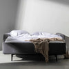 Lyons Silver Sleeper Sofa open with pillows and a blanket - DIGS