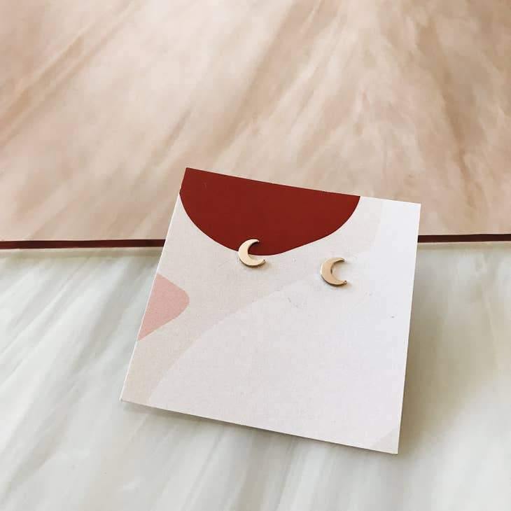 Crescent stud earrings  by Tumble.
